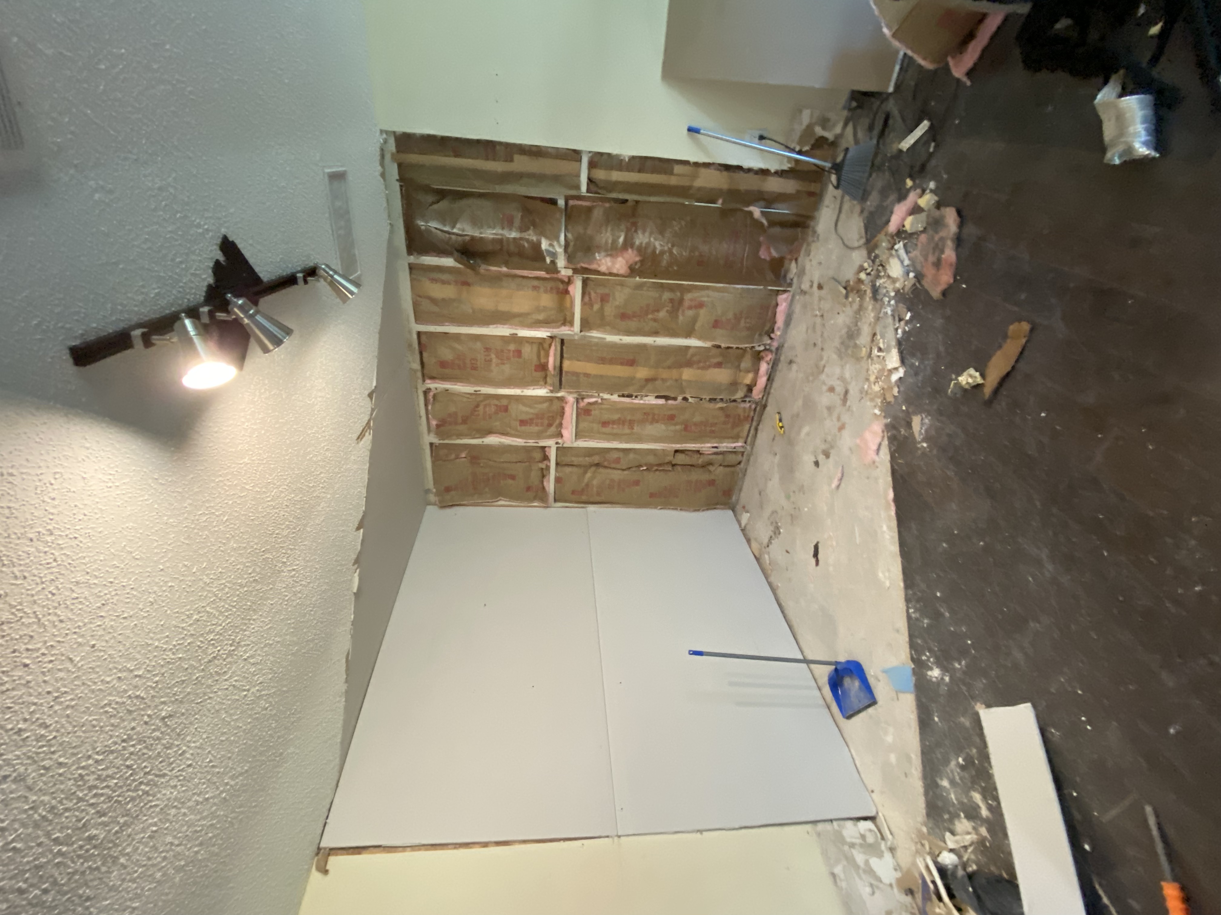 Drywall being installed over framing