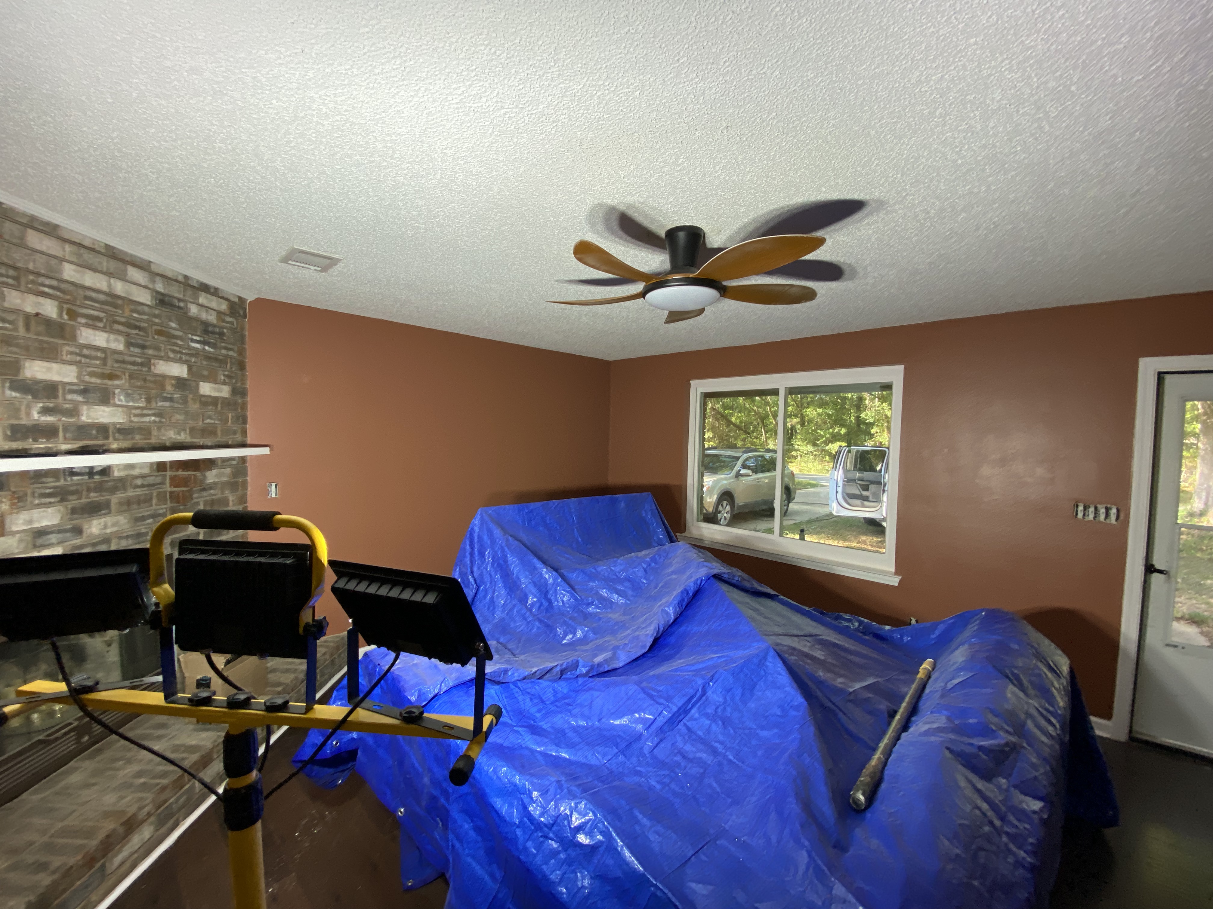 Living room with fresh terracotta paint and finished ceiling